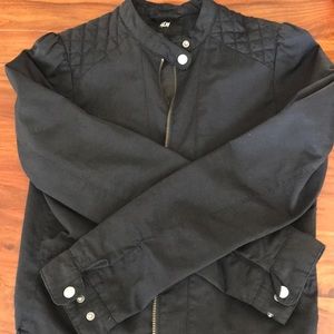 Black jacket with embellished shoulders.